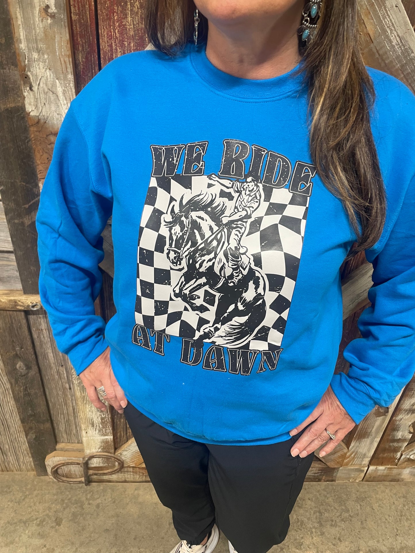 WE RIDE AT DAWN SWEATSHIRT